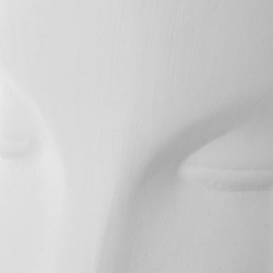 Figura rostro perfil crema y dorado