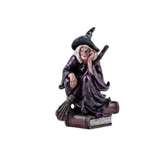 Figura bruja en libro Multicolor