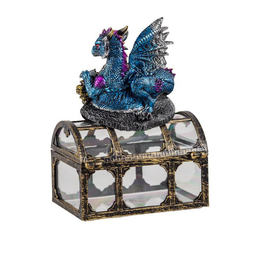 Figura de un dragon sobre un baul Azul