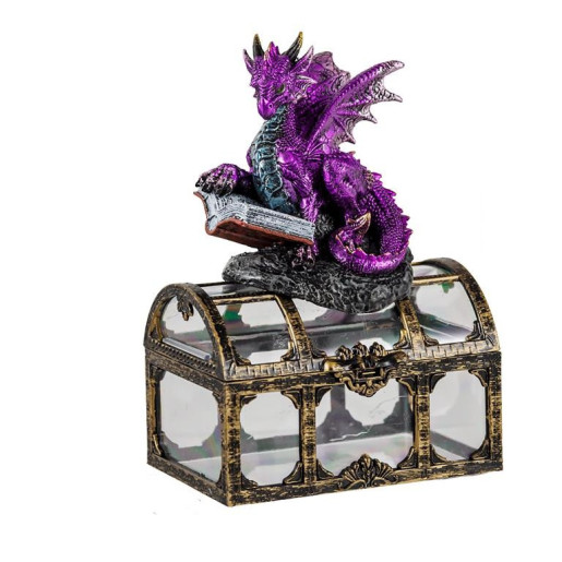 Figura de un dragon sobre un baul Morado