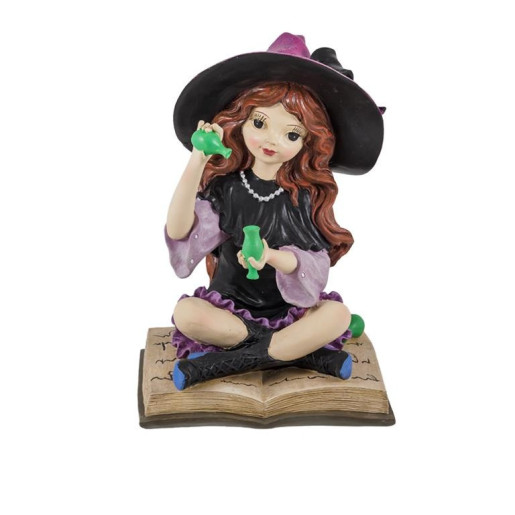 Bruja sobre libro